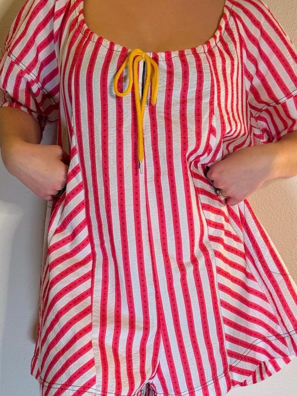 Amazon Red and White Striped Jumpsuit with Yellow Tie